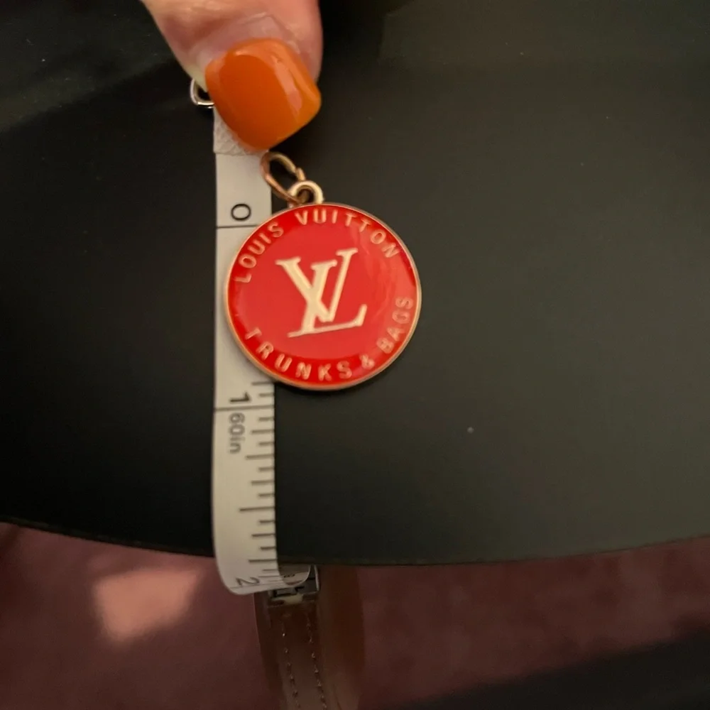 Louis Vuitton zipper pull/charm. Coral color 1” long